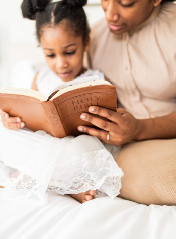 Mother and daughter reading the bible forDevotional Time