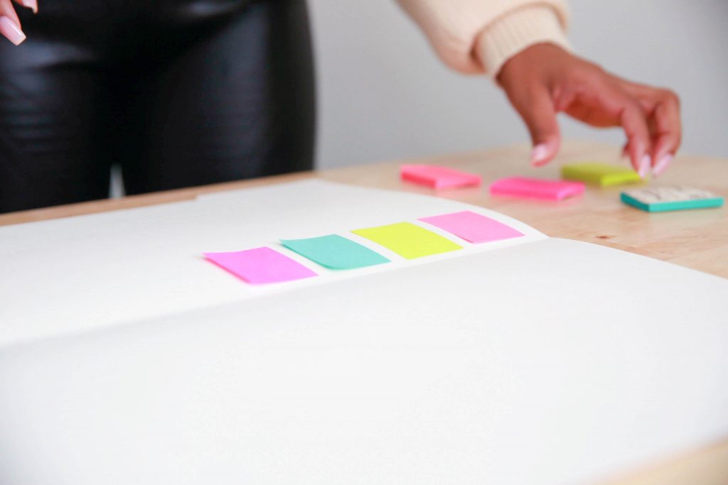 Placing sticky notes on white paper